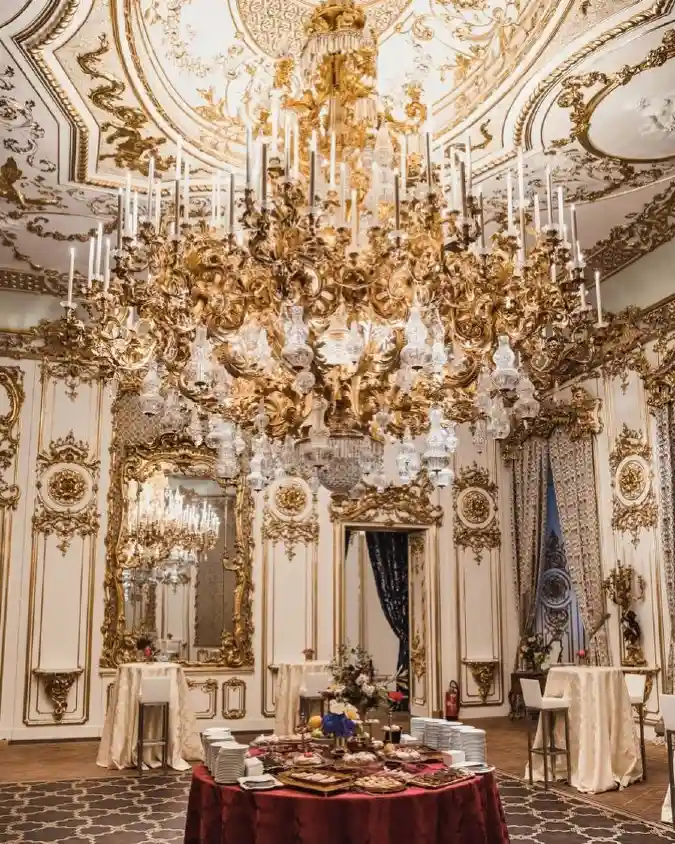 Gilded Crown: Statement Chandeliers and Ornate Moulding