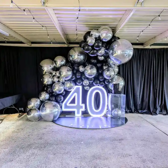 Illuminated Silver and Black Milestone Backdrop