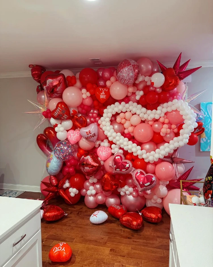 Maximalist Red and Pink Balloon Wall for a Statement Photo Op