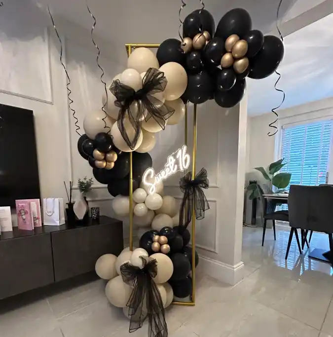 Modern Black and Gold Balloon Arch with Neon Sign